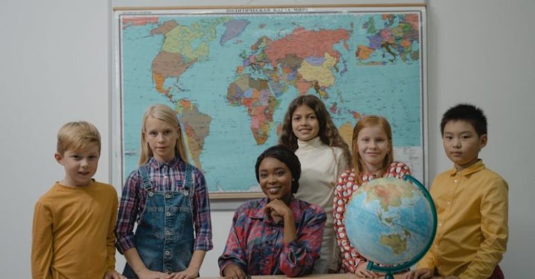 Learning - Teacher and a Group of Children Standing Beside Table With Globe