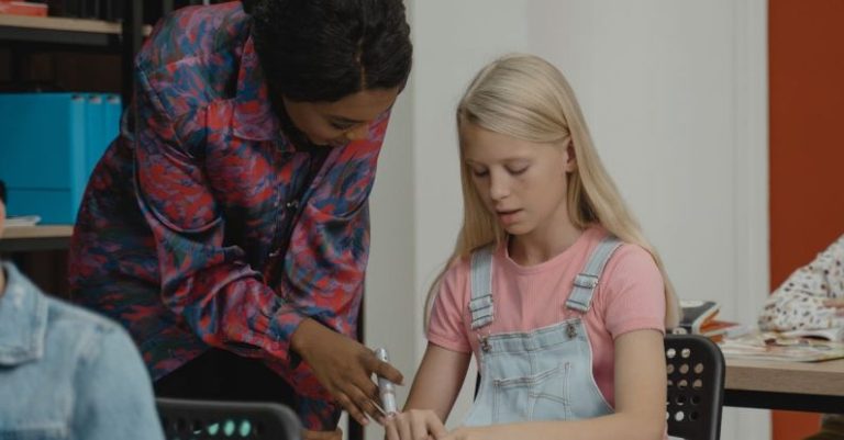 Learning - Teacher Helping a Student