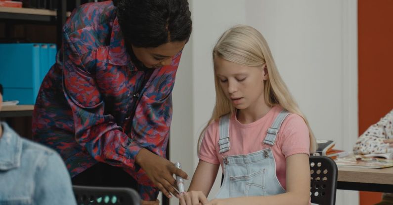 Learning - Teacher Helping a Student