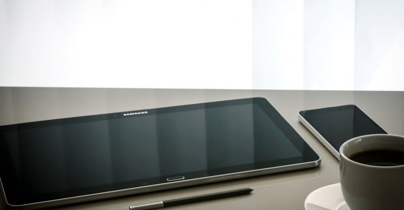 Management - Black Samsung Android Tablet Computer Beside Stylus Pen
