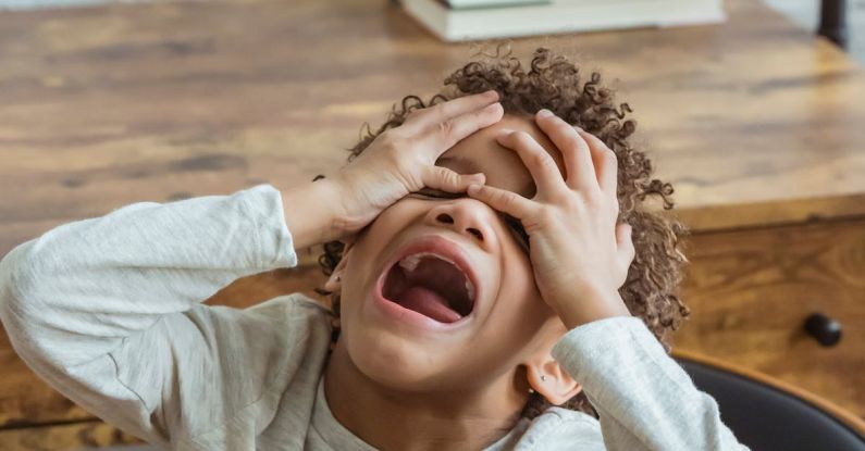 Disruptive Behavior - Black boy screaming in room