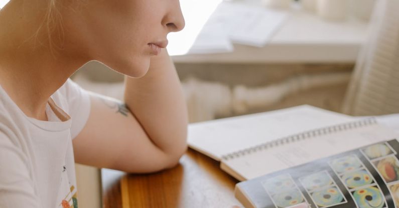 Online Learning - Girl in White Crew Neck T-shirt Sitting on Chair