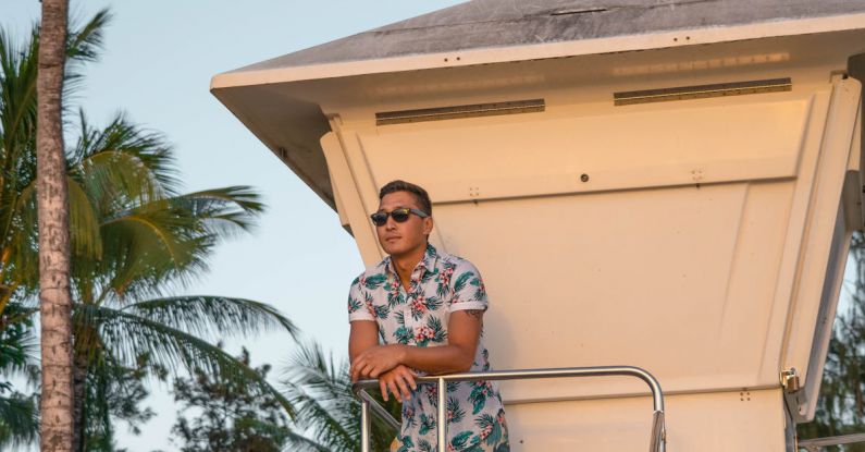 Safeguards - Tanned man in sunglasses standing on safeguard tower
